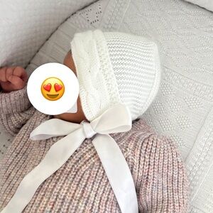 White knitted baby bonnet